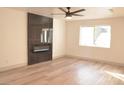 Living room featuring a modern fireplace and hardwood floors at 7409 Flat Rock St, Las Vegas, NV 89131