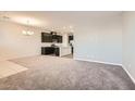 Spacious living room with gray carpeting and neutral walls at 762 Star Estates Ave, North Las Vegas, NV 89086