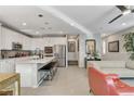 Modern kitchen with white cabinets, stainless steel appliances, and a large island at 889 Ariel Heights Ave, Las Vegas, NV 89138