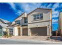 Two-story house with a two-car garage and landscaped front yard at 9008 Rolling Pietra St, Las Vegas, NV 89166