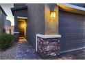 Home exterior showcasing a walkway, garage, and landscaping at 9181 Theodore Ct, Las Vegas, NV 89178