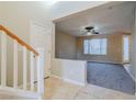 Bright entryway with staircase and view of living room at 9494 Stillwater Bend Ln, Las Vegas, NV 89178