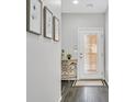 Bright entryway with dark hardwood floors and simple decor at 10330 Glacier Mist Ave, Las Vegas, NV 89149