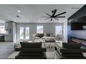 Virtually staged living room features a modern fireplace and comfortable seating at 1850 Banaba Ln, Las Vegas, NV 89156