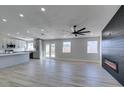 Open living area with fireplace and kitchen view at 1850 Banaba Ln, Las Vegas, NV 89156