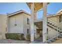 View of the building exterior showcasing the stairs and entryways of this multifamily residential property at 1963 Scimitar Dr # 0, Henderson, NV 89014