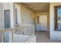 Close-up of the building's front entrance featuring a white front door and secure entry at 1963 Scimitar Dr # 0, Henderson, NV 89014