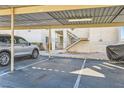 Assigned parking area with covered parking, numbered spots, and view of the building's exterior at 1963 Scimitar Dr # 0, Henderson, NV 89014