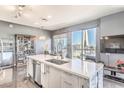 Modern kitchen features a large island, stainless steel appliances, and city views at 200 Sahara Ave # 1708, Las Vegas, NV 89102