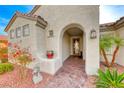 Elegant entryway with arched doorway and terracotta pot at 2373 Rosendale Village Ave, Henderson, NV 89052