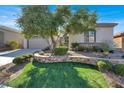 One-story home with attached garage and attractive landscaping at 2423 Blair Castle St, Henderson, NV 89044