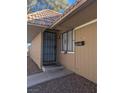 Front door entrance to the house with a security door at 2567 Paradise Village Way, Las Vegas, NV 89120