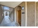 Building entryway with brown door and walkway at 2900 Sunridge Heights Pkwy # 1514, Henderson, NV 89052