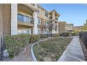 Building exterior with green landscaping and walkway at 2900 Sunridge Heights Pkwy # 1514, Henderson, NV 89052