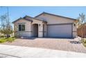 Front view of the house with a brick driveway at 2905 Carothers Ct, North Las Vegas, NV 89032