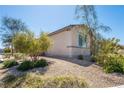 Side view of the house showcasing desert landscaping at 2905 Carothers Ct, North Las Vegas, NV 89032