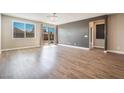 Spacious living room with wood-look floors and sliding glass doors at 2905 Carothers Ct, North Las Vegas, NV 89032