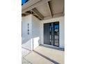 Modern front door with glass panels and sleek design at 3180 S Tioga Way, Las Vegas, NV 89117