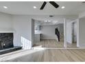 Living room with an open floor plan showing kitchen and stairs at 3367 Vema Dr, Las Vegas, NV 89121