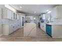 Spacious kitchen featuring white cabinets, quartz countertops, and modern appliances at 3446 Cactus Springs Dr, Las Vegas, NV 89115