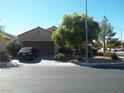 House exterior showcasing a two-car garage and desert landscaping at 3925 Vulcan St, Las Vegas, NV 89122