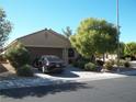 Front view of a single-story house with a two-car garage at 3925 Vulcan St, Las Vegas, NV 89122