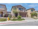 Two-story home with attached garage and landscaped front yard at 4138 Bayley Skye Ave, Las Vegas, NV 89141