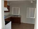 Simple kitchen with wood cabinets and tile floors at 431 Bedford Rd, Las Vegas, NV 89107