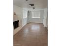 Bright living room with tile floors and a fireplace at 431 Bedford Rd, Las Vegas, NV 89107