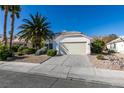 Single-story house with attached garage and desert landscaping at 4421 Rodman Dr, Las Vegas, NV 89130