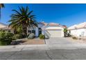 Single-story house with attached garage and desert landscaping at 4421 Rodman Dr, Las Vegas, NV 89130