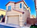 Two-story house with tan exterior, red roof accents, and a garage at 4520 Lemon Gems Ct, Las Vegas, NV 89130