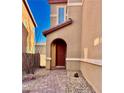 Inviting front entrance with red door and brick pathway at 4520 Lemon Gems Ct, Las Vegas, NV 89130