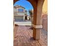 Brick walkway leading to the house entrance at 4520 Lemon Gems Ct, Las Vegas, NV 89130