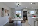 Bright dining area with marble table and access to the backyard at 4962 E Baltimore Ave, Las Vegas, NV 89104