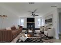 Virtually staged living room featuring a fireplace and comfortable seating at 4962 E Baltimore Ave, Las Vegas, NV 89104