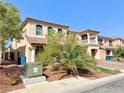 Two-story house with a brick driveway and palm trees at 6454 Mount Palomar Ave, Las Vegas, NV 89139