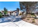 Single story home with a landscaped front yard and driveway at 659 I, Boulder City, NV 89005