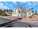 Two-story house with a two-car garage and a view of the street at 718 Glenwood Springs Ave, North Las Vegas, NV 89032