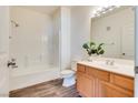 Bathroom boasts wood cabinets and a shower/tub combo at 833 Aspen Peak Loop # 2524, Henderson, NV 89011