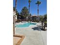 Inviting community pool with surrounding lounge chairs at 8600 W Charleston Blvd # 1129, Las Vegas, NV 89117