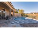 Luxury pool with spa and mountain views at 9316 Provence Garden Ln, Las Vegas, NV 89145