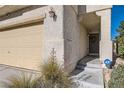 Front entrance with steps leading to the door and landscaping at 9462 Diamond Bridge Ave, Las Vegas, NV 89166