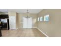 Dining area with tile floors and a chandelier at 9490 Alma Ridge Ave, Las Vegas, NV 89178