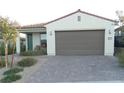 Charming single-story home with a spacious two-car garage and well-maintained landscaping at 9577 Among Ln, Las Vegas, NV 89143