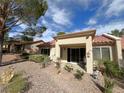 Private backyard patio with desert landscaping at 10065 Hemet Dr, Las Vegas, NV 89134