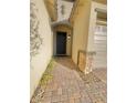 Inviting entryway with a dark-stained door and brick accents at 10328 Planter Box St, Las Vegas, NV 89178