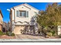 Two-story house with attached garage, neutral paint, and landscaping at 10546 Hartford Hills Ave, Las Vegas, NV 89166