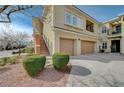 Two-story townhome with attached two-car garage and landscaped front yard at 10809 Garden Mist Dr Dr # 2041, Las Vegas, NV 89135