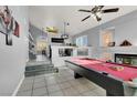 Game room featuring a pool table, fireplace, and high ceilings at 1138 Aspen Valley Ave, Las Vegas, NV 89123